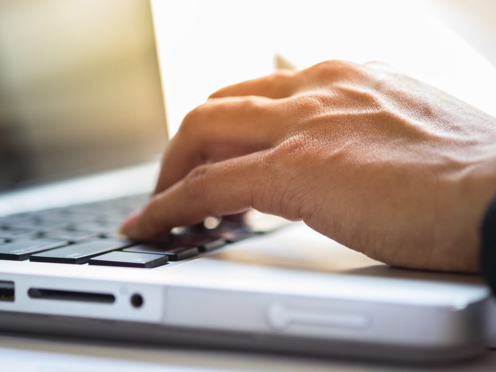 close up typing male hands